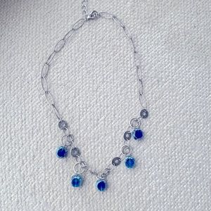 Artisanal sterling silver with natural patina and blue glass beaded necklace